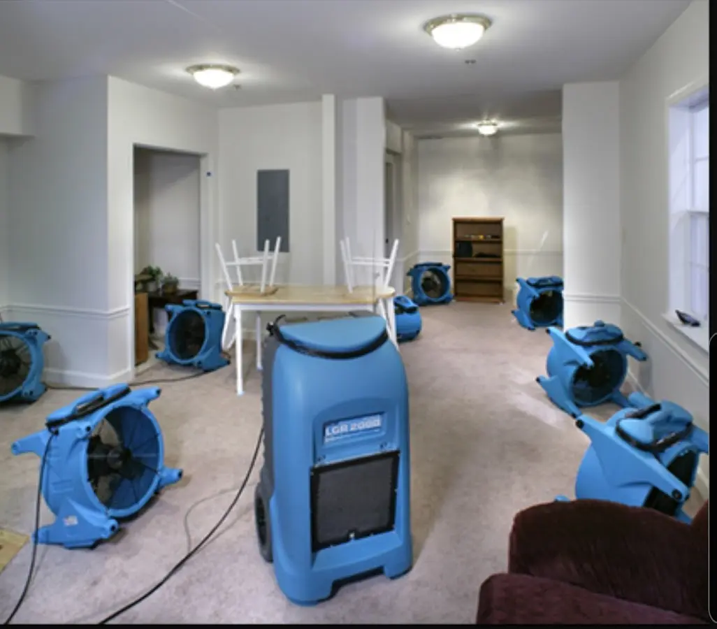 Air movers and dehumidifier setup for Water Extraction & Removal in Inkster